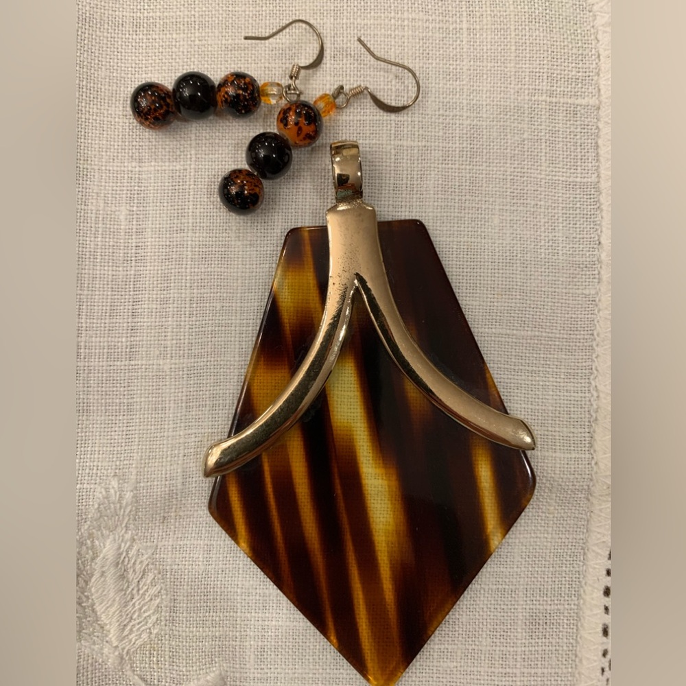 Vintage pendant & earrings. Lucite with gold tone trim. Brown tones